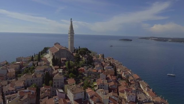 Pull back aerial drone shot over Rovini old town, city centre in Croatia.