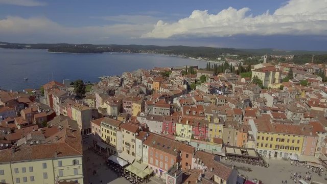 Aerial pull back pan left drone shot over the old town of Rovini, Europe Croatia.