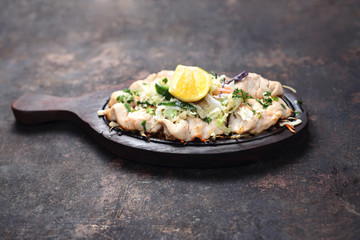 Chicken malai tikka on a hot dish