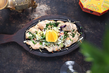 Chicken malai tikka on a hot dish