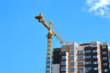 Crane and highrise construction site