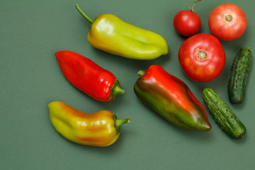 Top view on fresh vegetables and fruits on green background.