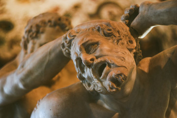 White Marbled statue man in pain Florence Italy 