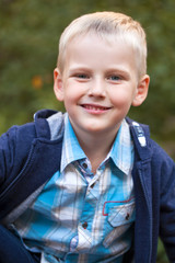  Little blonde boy, summer park outdoors