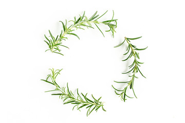 Round wreath frame made of mix of herbs, green branches, leaves rosemary and thyme. Set of medicinal herbs. Flat lay. Top view.