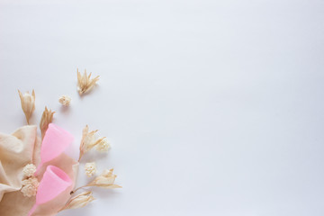 Fototapeta na wymiar Menstrual cup with flowers on white background. Close up, flatlay