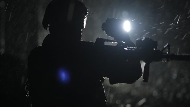 Military Night Time Operation. Army Soldier in the Dark Forest. Slow Motion Footage.