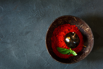 Chili Pepper Powder with basil in bowl on grey background - 289086778