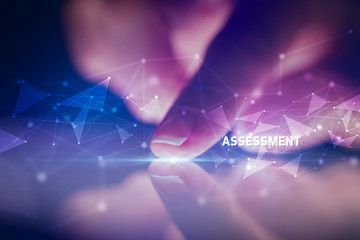 Finger touching tablet with ASSESSMENT inscription, business concept