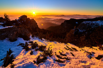 Fototapeta na wymiar Aerial Landscape view from Ceahlău Mountains National Park at sunset in winter season,Sunset in Ceahlau Mountains
