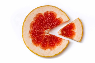 Fototapeta na wymiar Ripe slice of red grapefruit on a white background close-up. Citrus isolated object. Cut a slice of sour fruit.