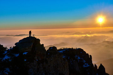 Naklejka premium Aerial Landscape view from Ceahlău Mountains National Park at sunset in winter season,Sunset in Ceahlau Mountains