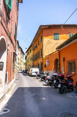 Obraz premium Beauty and narrow street with colorful houses in Pisa,Tuscany, Italy
