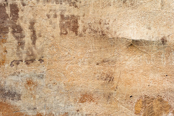 Texture of a concrete wall with cracks and scratches which can be used as a background