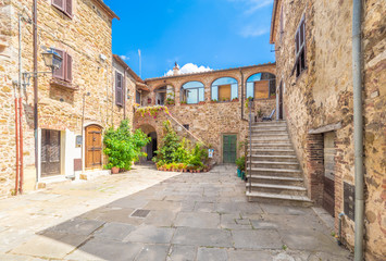 Fototapeta na wymiar Montemerano (Italy) - The awesome historical center of the medieval and renaissance stone town in Tuscany region, on the hill; province of Grosseto.
