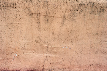 Texture of a concrete wall with cracks and scratches which can be used as a background