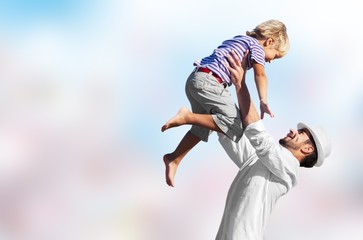 Family happy outside sunset vacation lifestyle hug