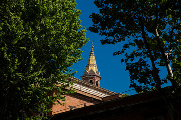 Fototapeta premium Top of the tower of the Pontifical University Antonianum built on 1890 in Rome