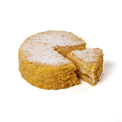 Honey cake Medovik with one piece cut out isolated on white background