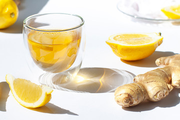 Glass of green tea with lemon and ginger close up
