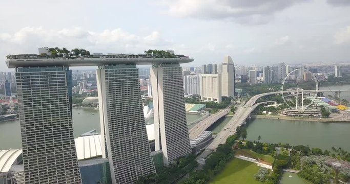 Marina Bay Sansa and Singapore Flyer are shot from the air by drone, Singapore