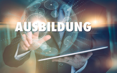 A hand selecting a Education "Ausbildung" business concept in German on a futuristic computer display.