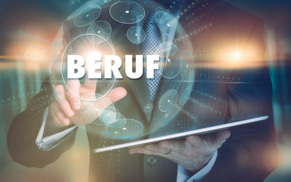 A hand selecting a Job "Beruf" business concept in German on a futuristic computer display.