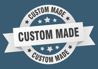 custom made ribbon. custom made round white sign. custom made