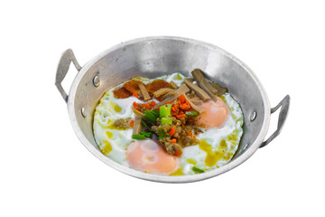 Fried eggs in a pan with bacon and vegetables for Breakfast isolated on white background with clipping path.