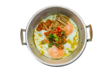 Fried eggs in a pan with bacon and vegetables for Breakfast isolated on white background with clipping path.