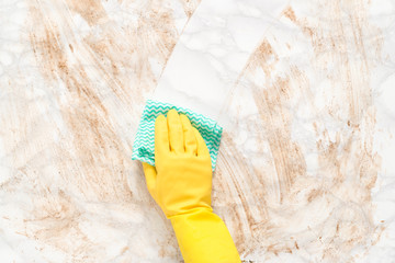 Hand in Glove Wiping Clean a Dirty Counter with Paper Towel