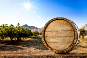 Wooden barrel on desk and autumn time. 