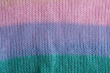 texture of the knitted fabric carpet pastel color. pink,green blue,yellow