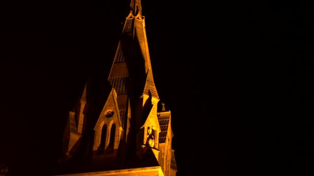 Rack focus of old English castle at night 