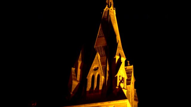 Rack focus of old English castle at night 