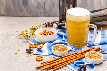 Oktoberfest set. Light beer, pretzels, mustard, sesame straw, hop.