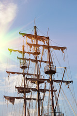 Rigging pausnika against the blue sky. Masts.