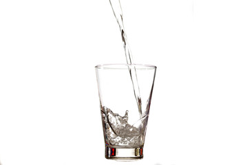 water splashing to glass isolated on white background