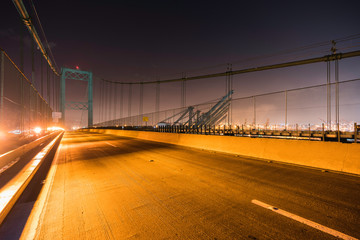 Night view of Vincent Thomas Bridge above Los Angeles Harbor, San Pedro and Terminal Island in Southern California.  