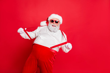 Fototapeta na wymiar Ho-ho-ho holly jolly noel. Photo of cheerful laughing grandfather pulling holding boasting suspenders on trousers having fun time on vacation weekend isolated bright background