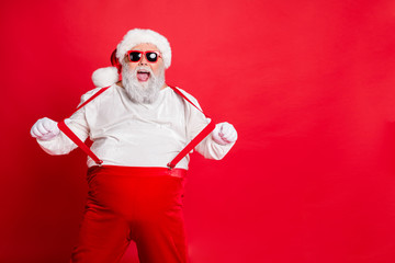 Portrait of funny fat overweight santa claus with big belly abdomen forever young touch his...