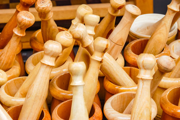 Garlic presses and Pestles on the market or bazaar. Selective Focus.