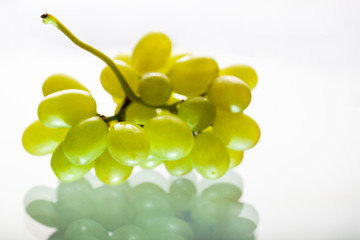 Bunch of white grapes with reflection