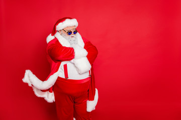 Photo of cool concentrated serious modern wearing fur cap holding arms crossed waiting for you flying coat suspenders trousers pants isolated bright background copy empty space