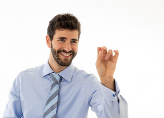 Portrait of a young handsome and confident businessman pointing as touching virtual screen