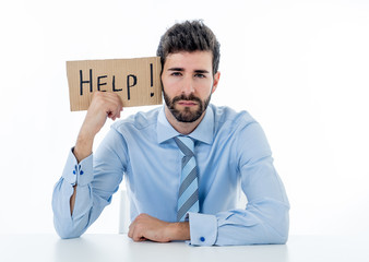 Young Businessman Holding Cardboard With Help Text At Workplace in stress and pressure at work.