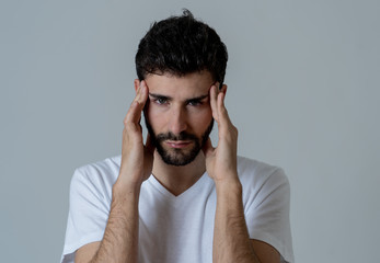 Portrait of sad man in pain having headache and migraines