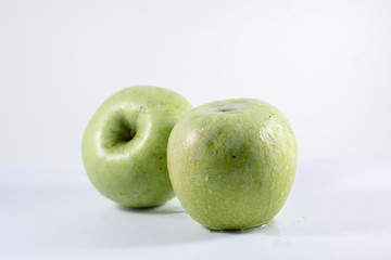 green apples on white background