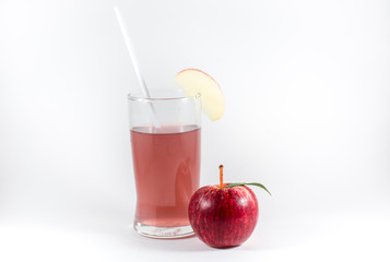 glass of juice and red apple isolated on white