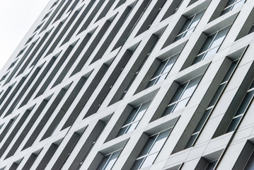 Skyscraper, walls of a high-rise building with windows pattern.
